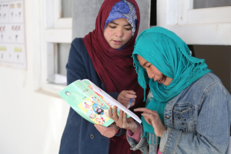 Khadija (13) is able to learn how to read with her teacher thanks to a community-based school established by UNICEF. Photo courtesy of Sheida.
