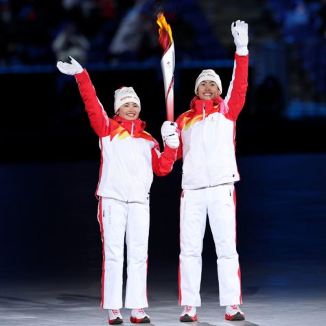Yilamujiang and Zhao carrying the Olympic torch at the opening ceremony in Beijing, China.
