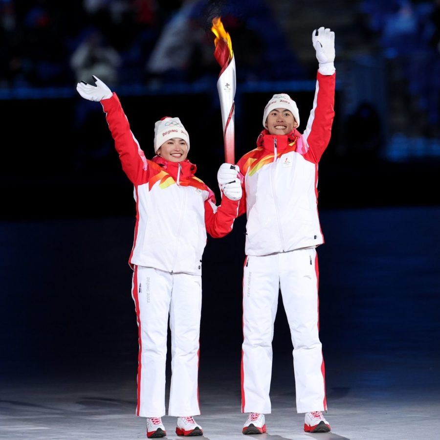 Yilamujiang+and+Zhao+carrying+the+Olympic+torch+at+the+opening+ceremony+in+Beijing%2C+China.%0A