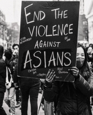 A woman holds a sign at the End Violence Toward Asians March in NYC from Feb. 20, 2021. (credit: @stopasianhate on Instagram)